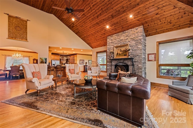 102 Coyote Rdg, Maggie Valley, NC 28751 - living room with a chandelier, high vaulted ceiling, arched walkways, wooden ceiling, and healthy amount of natural light