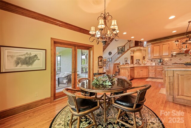 102 Coyote Rdg, Maggie Valley, NC 28751 - dining room featuring french doors, light wood-style floors, stairway, a chandelier, and recessed lighting