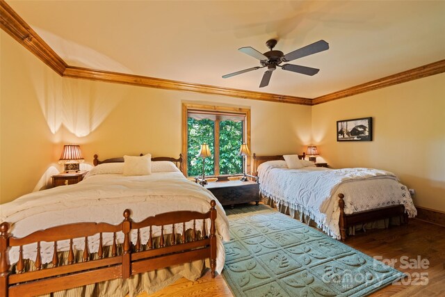 102 Coyote Rdg, Maggie Valley, NC 28751 - bedroom featuring crown molding, wood finished floors, ceiling fan, and baseboards