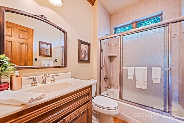 102 Coyote Rdg, Maggie Valley, NC 28751 - full bath with vanity, toilet, and bath / shower combo with glass door