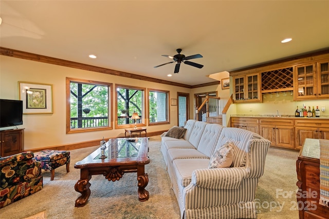 102 Coyote Rdg, Maggie Valley, NC 28751 - living room with bar with sink, light colored carpet, ornamental molding, recessed lighting, and a ceiling fan