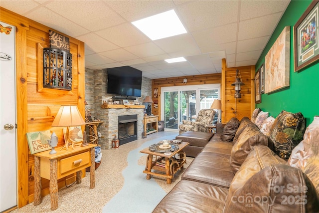 333 Garden Valley Dr, Winston Salem, NC 27107 - living area featuring a drop ceiling, wooden walls, a fireplace, and carpet floors