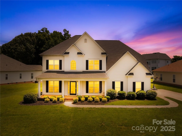 112 Doyle Farm Ln, Mooresville, NC 28115 - traditional-style home with a porch, a front yard, and a shingled roof