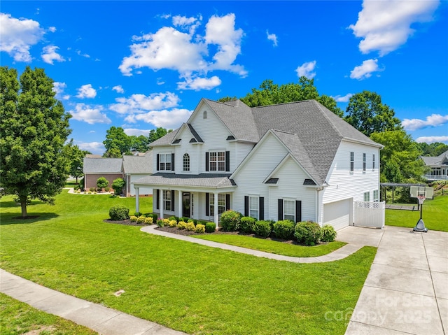 112 Doyle Farm Ln, Mooresville, NC 28115 - traditional home with an attached garage, concrete driveway, a front lawn, and a porch