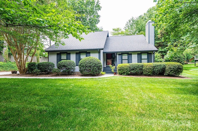 3221 5th Street Ct NW, Hickory, NC 28601 - view of front facade with a chimney, a front yard, and roof with shingles
