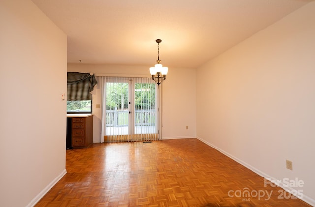 3221 5th Street Ct NW, Hickory, NC 28601 - unfurnished room with baseboards and a chandelier