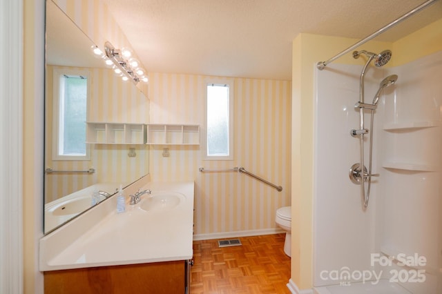 3221 5th Street Ct NW, Hickory, NC 28601 - full bathroom featuring wallpapered walls, toilet, baseboards, vanity, and a shower