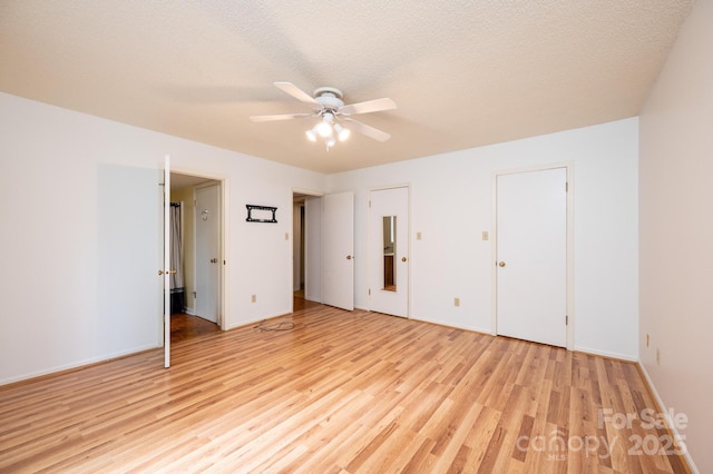 3221 5th Street Ct NW, Hickory, NC 28601 - unfurnished bedroom with light wood-type flooring, baseboards, and a ceiling fan