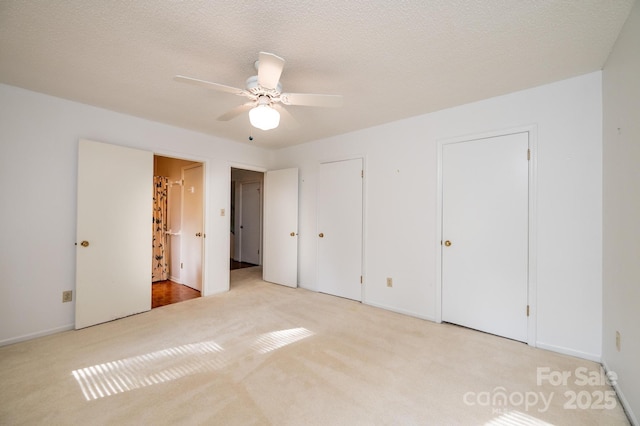 3221 5th Street Ct NW, Hickory, NC 28601 - unfurnished bedroom with carpet flooring, multiple closets, baseboards, and a ceiling fan