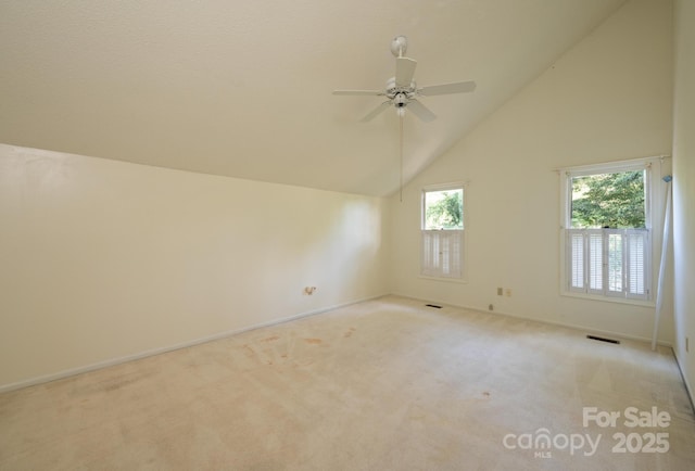 3221 5th Street Ct NW, Hickory, NC 28601 - empty room with light colored carpet, a ceiling fan, baseboards, and high vaulted ceiling