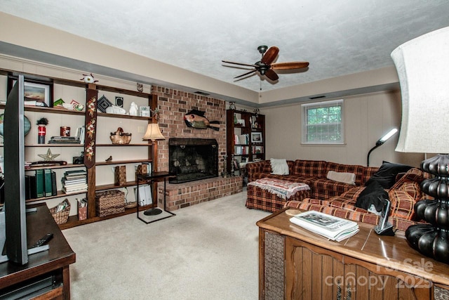 928 Tally Ho Ct, Charlotte, NC 28212 - living room featuring ceiling fan, carpet flooring, and a brick fireplace