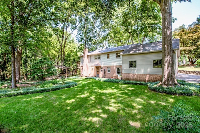 928 Tally Ho Ct, Charlotte, NC 28212 - back of property with a lawn and a chimney
