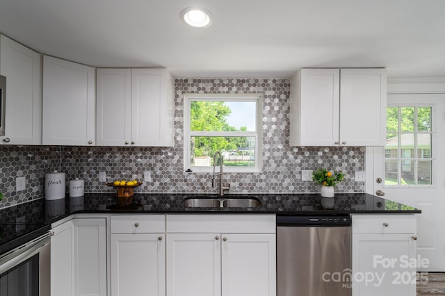 1212 Frank Ext, Rock Hill, SC 29730 - kitchen with stainless steel appliances, a sink, backsplash, and white cabinets
