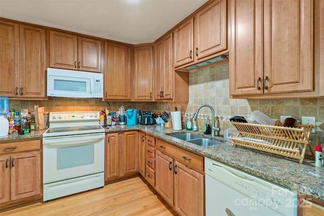 14 Luckenbach Dr, Fairview, NC 28730 - kitchen with white appliances, a sink, light stone counters, light wood-type flooring, and backsplash