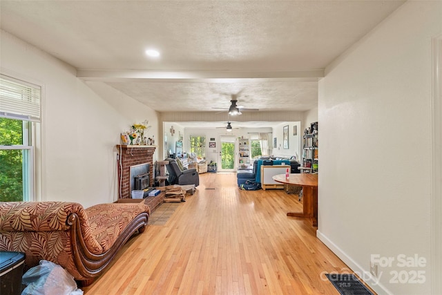 14 Luckenbach Dr, Fairview, NC 28730 - living room with light wood-style floors, a brick fireplace, and plenty of natural light