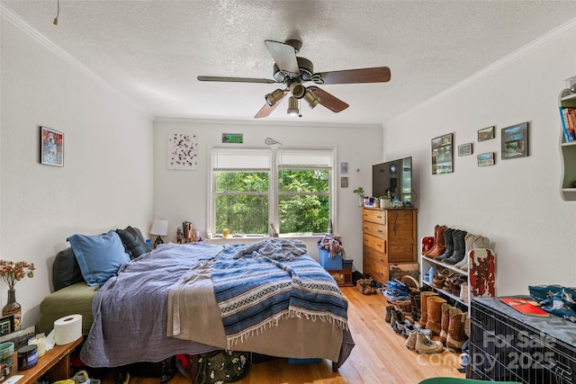 14 Luckenbach Dr, Fairview, NC 28730 - bedroom featuring a textured ceiling, wood finished floors, crown molding, and a ceiling fan