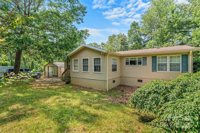 14 Luckenbach Dr, Fairview, NC 28730 - back of house with crawl space and a lawn