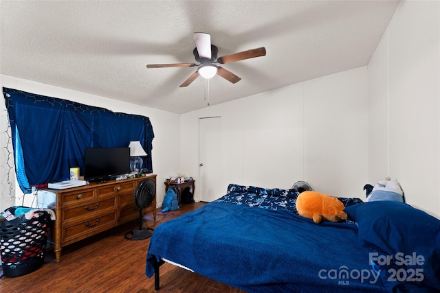 14 Luckenbach Dr, Fairview, NC 28730 - bedroom featuring wood finished floors, a textured ceiling, and a ceiling fan