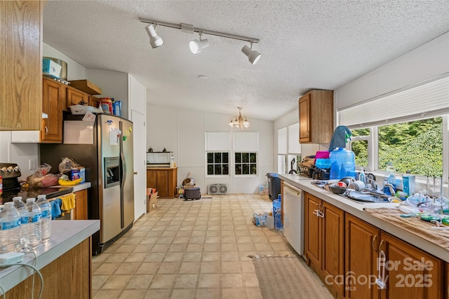 14 Luckenbach Dr, Fairview, NC 28730 - kitchen featuring brown cabinets, a chandelier, white dishwasher, light countertops, and stainless steel fridge with ice dispenser