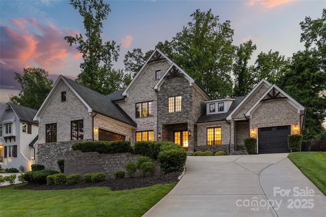 5638 Timber Ln, Charlotte, NC 28270 - craftsman-style home featuring an attached garage, driveway, stone siding, a front lawn, and brick siding