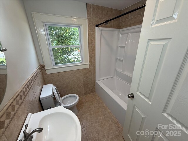 322 Buffalo St, Shelby, NC 28150 - full bath with tile walls, tile patterned floors, and bathtub / shower combination