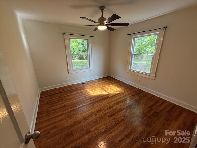 322 Buffalo St, Shelby, NC 28150 - unfurnished room featuring healthy amount of natural light, wood finished floors, and a ceiling fan