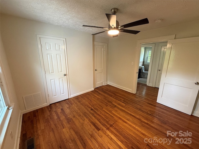 322 Buffalo St, Shelby, NC 28150 - unfurnished bedroom with wood finished floors, a textured ceiling, and a ceiling fan