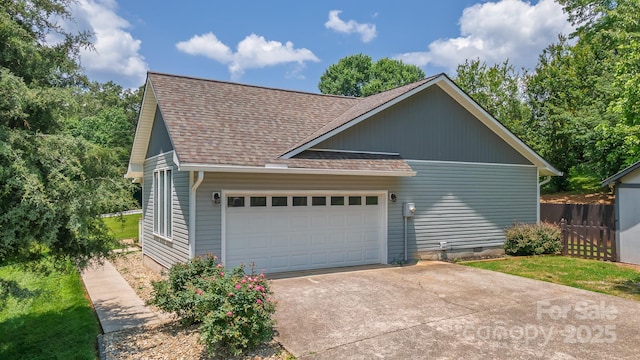 100 Donna Dr, Franklin, NC 28734 - view of home's exterior with driveway, roof with shingles, and a garage