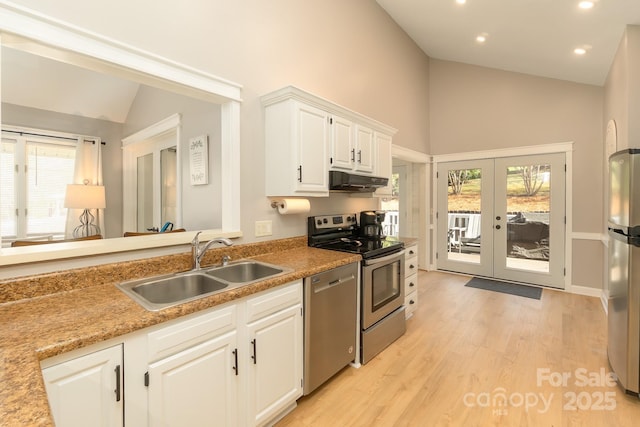 100 Donna Dr, Franklin, NC 28734 - kitchen with stainless steel appliances, a sink, under cabinet range hood, french doors, and plenty of natural light