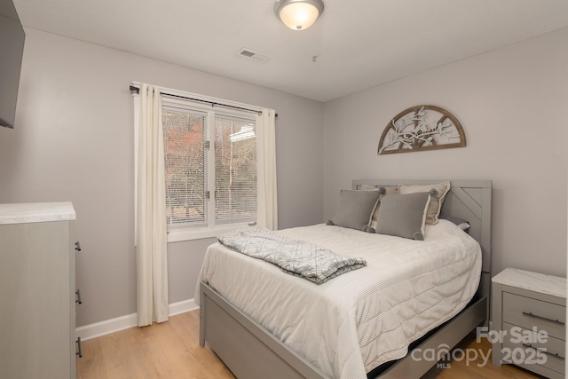 100 Donna Dr, Franklin, NC 28734 - bedroom with light wood finished floors and baseboards