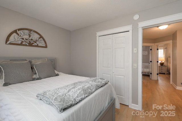 100 Donna Dr, Franklin, NC 28734 - bedroom featuring radiator, light wood finished floors, a closet, and baseboards