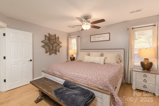 100 Donna Dr, Franklin, NC 28734 - bedroom with light wood finished floors and a ceiling fan