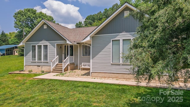 100 Donna Dr, Franklin, NC 28734 - view of front of house with a shingled roof and a front lawn