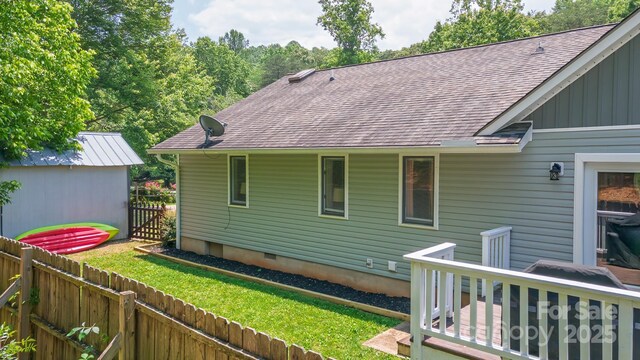 100 Donna Dr, Franklin, NC 28734 - back of property with crawl space, roof with shingles, and board and batten siding
