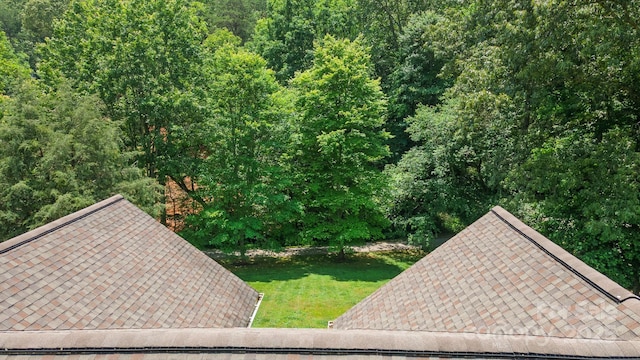 100 Donna Dr, Franklin, NC 28734 - exterior view of a shingled roof and a heavily wooded area
