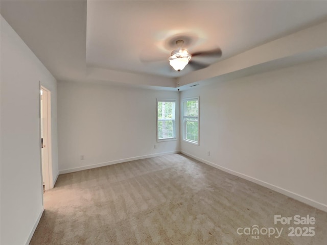 2612 Cold Springs Rd, Concord, NC 28025 - unfurnished room with a raised ceiling, baseboards, and carpet floors