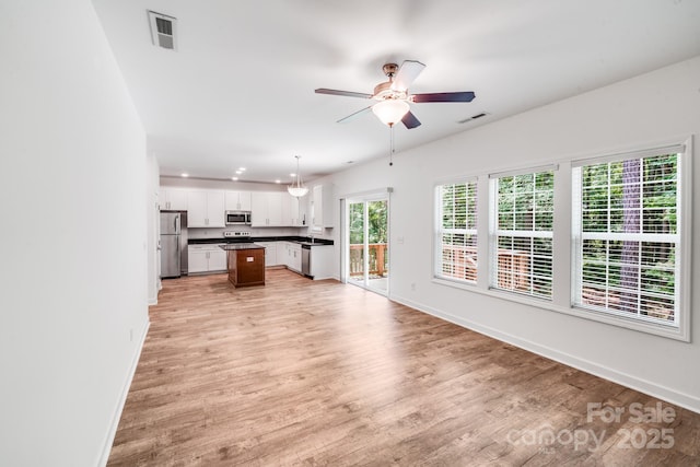 2612 Cold Springs Rd, Concord, NC 28025 - unfurnished living room featuring a ceiling fan, light wood-style floors, and recessed lighting