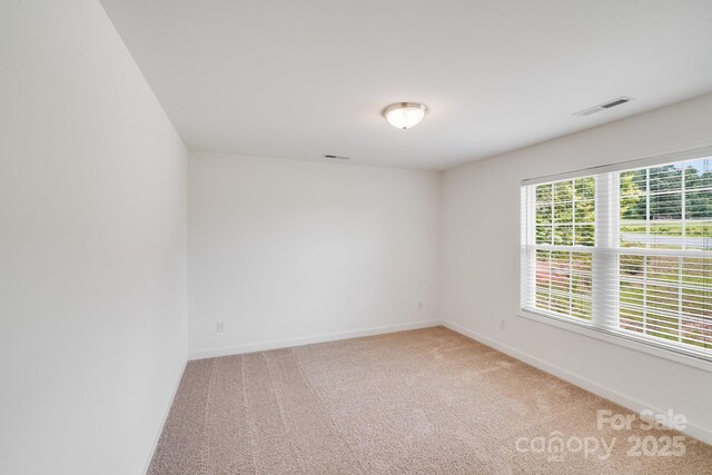 2612 Cold Springs Rd, Concord, NC 28025 - carpeted spare room with baseboards