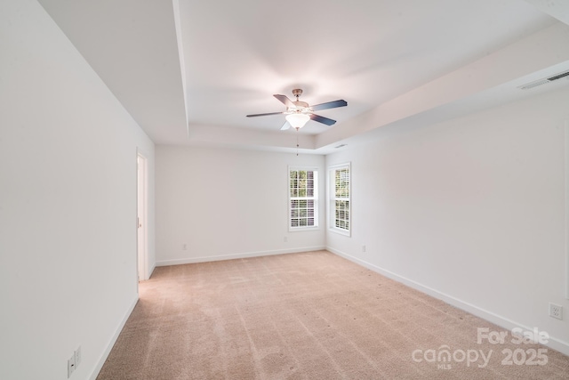 2612 Cold Springs Rd, Concord, NC 28025 - empty room with ceiling fan, light carpet, and a raised ceiling