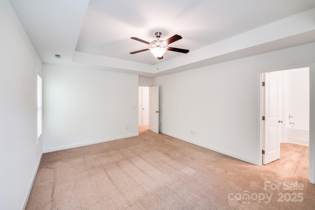2612 Cold Springs Rd, Concord, NC 28025 - unfurnished bedroom featuring carpet, a tray ceiling, and ensuite bath