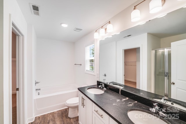 2612 Cold Springs Rd, Concord, NC 28025 - bathroom with wood finished floors, a garden tub, a walk in closet, a stall shower, and double vanity