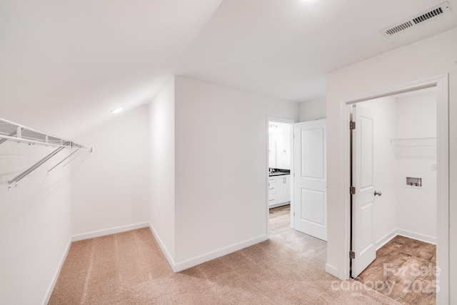 2612 Cold Springs Rd, Concord, NC 28025 - walk in closet featuring light carpet and vaulted ceiling