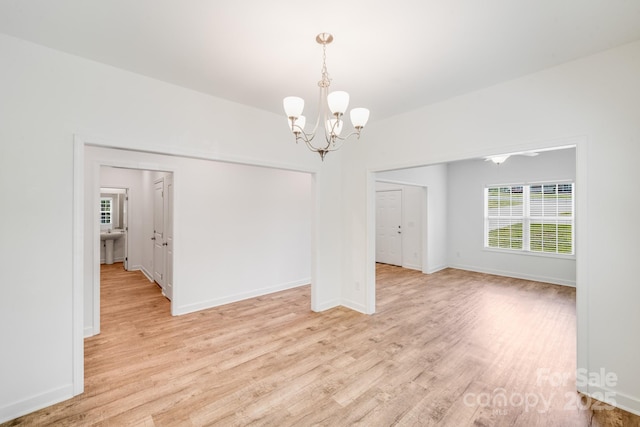 2612 Cold Springs Rd, Concord, NC 28025 - spare room featuring light wood-style floors and a chandelier