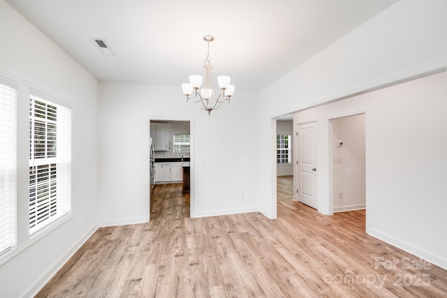 2612 Cold Springs Rd, Concord, NC 28025 - unfurnished dining area featuring a chandelier and light wood finished floors