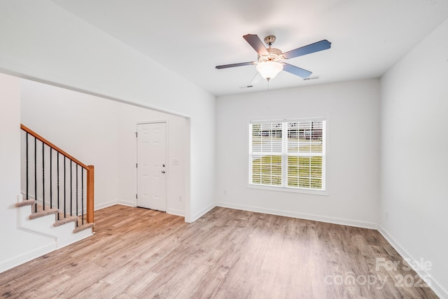 2612 Cold Springs Rd, Concord, NC 28025 - unfurnished room featuring wood finished floors, stairway, and ceiling fan