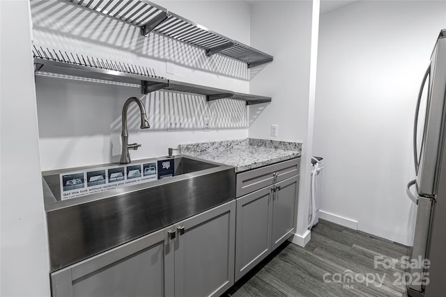 338 Orchard Trace Ln Unit 8, Charlotte, NC 28213 - kitchen with open shelves, freestanding refrigerator, dark wood-style floors, gray cabinets, and baseboards