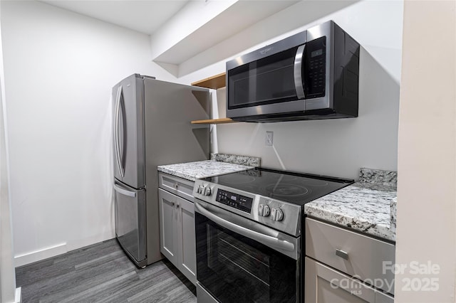 338 Orchard Trace Ln Unit 8, Charlotte, NC 28213 - kitchen with stainless steel appliances, gray cabinets, wood finished floors, open shelves, and light stone countertops