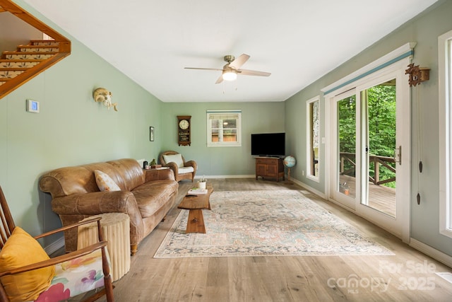24 Cataloochee Ln, Waynesville, NC 28785 - living room featuring ceiling fan, wood finished floors, and stairway