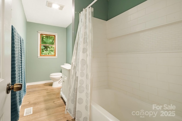 24 Cataloochee Ln, Waynesville, NC 28785 - bathroom featuring shower / tub combo with curtain and wood finished floors