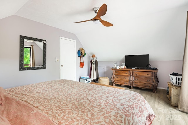 24 Cataloochee Ln, Waynesville, NC 28785 - bedroom with lofted ceiling, light wood-style flooring, and ceiling fan